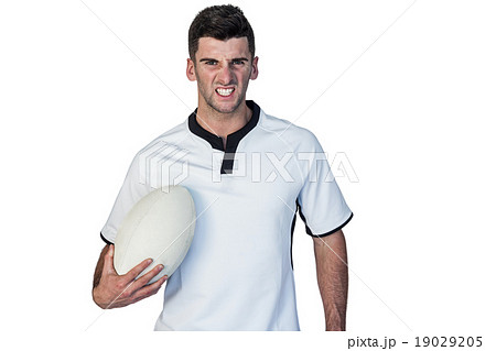 Portrait of an irritated rugby holding ball Portrait of an irritated rugby holding ball 19029205