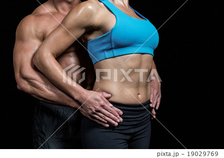 Midsection of healthy couple with hands on hip Midsection of healthy couple with hands on hip 19029769