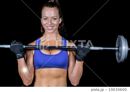 Portrait of happy woman lifting crossfit Portrait of happy woman lifting crossfit 19030600