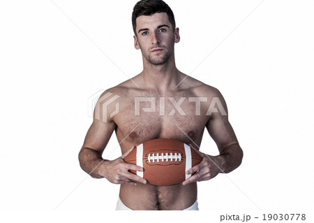 Portrait of shirtless rugby player with the ball 19030778
