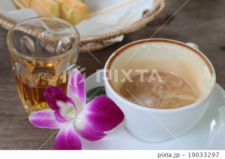 Hot latte coffee and hot tea with toast. Hot latte coffee and hot tea with toast. 19033297