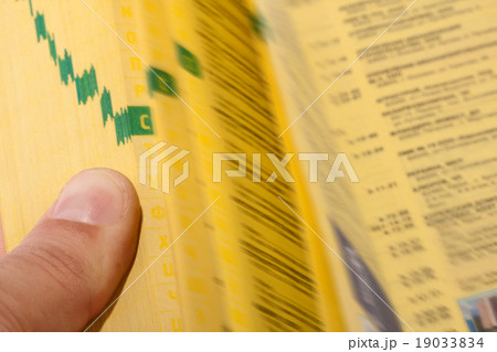 Hand searching the yellow pages Hand searching the yellow pages 19033834