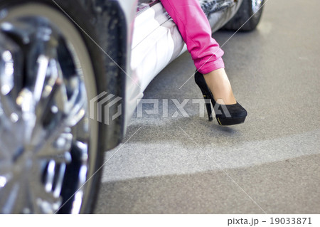 Celebrity woman exiting sportcar 19033871