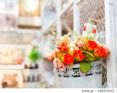 Beautiful bouquet of bright flowers in basket 19034203