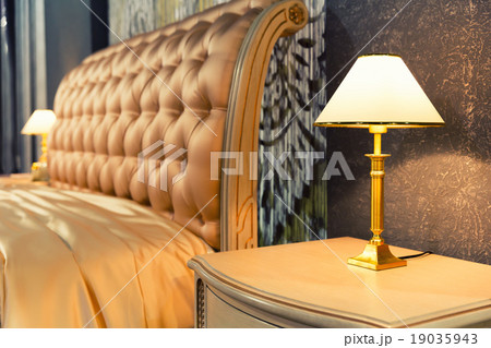 Nice bed in typical contemporary setting 19035943