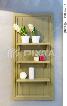 Shelf with flowers and cosmetics Shelf with flowers and cosmetics 19036734