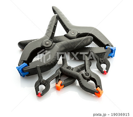 Plastic clamps on white background Plastic clamps on white background 19036915