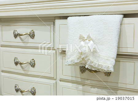 White chest of drawers with a towel White chest of drawers with a towel 19037015