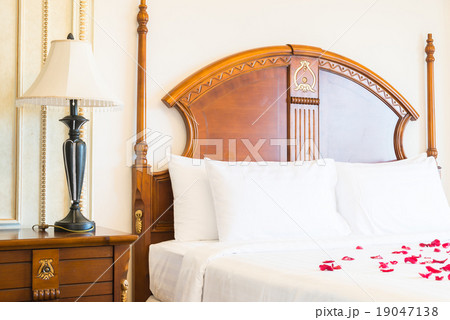 Pillow on bed and light lamp decoration 19047138