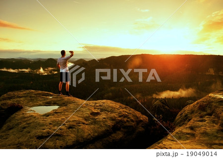 Tired runner man in target with hand in the air 19049014