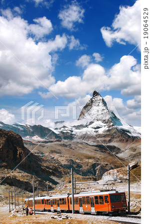 Matterhorn peak with a train in Swiss Alps Matterhorn peak with a train in Swiss Alps 19064529