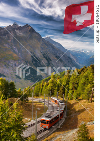 Matterhorn peak with a train in Swiss Alps 19064531