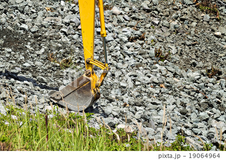 excavator shovel digging rock on constriction site excavator shovel digging rock on constriction site 19064964