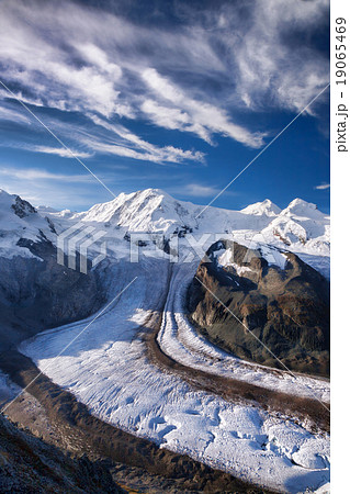 Swiss Alps with glaciers against blue sky Swiss Alps with glaciers against blue sky 19065469