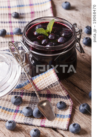 Rustic of blueberry jam in a glass jar close up Rustic of blueberry jam in a glass jar close up 19068470