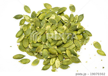 Pumpkin seeds on a white background Pumpkin seeds on a white background 19070302