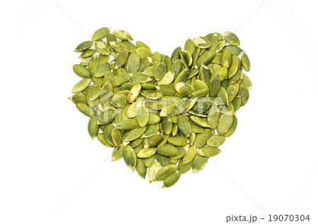 Pumpkin seeds on a white background 19070304