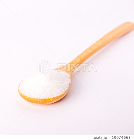 sugar on a teaspoon on white background, 19074663