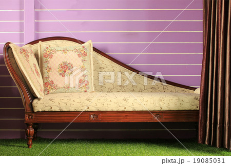 Opened curtain and vintage sofa 19085031