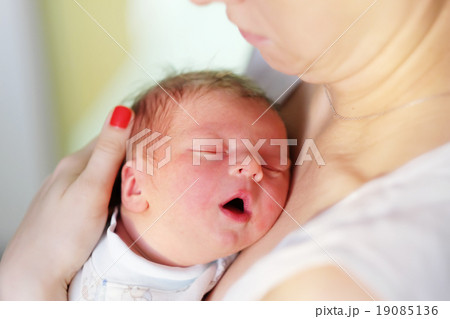 One day old newborn baby with mother One day old newborn baby with mother 19085136