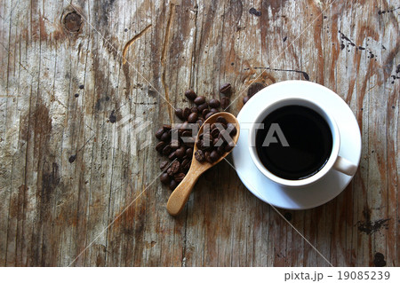A cup of coffee on wooden table  19085239