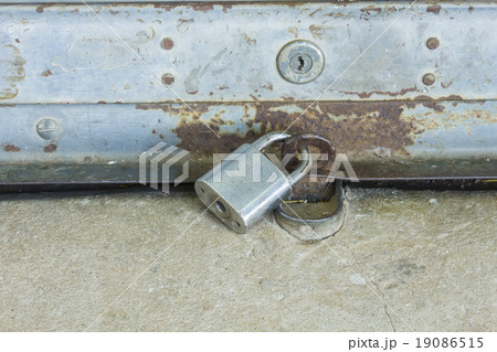 old shutter door with hasp - Key lock pad old shutter door with hasp - Key lock pad 19086515