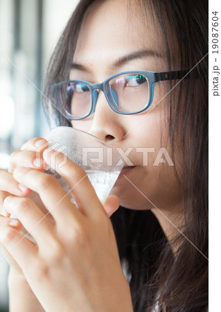 Asia woman drink water. 19087604