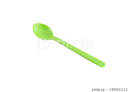 Green plastic spoon isolated on white. Green plastic spoon isolated on white. 19092212