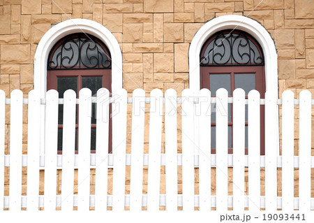 White fences and windows. 19093441