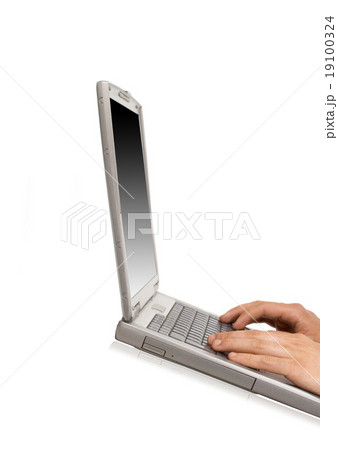 Businessman typing on a notebook Businessman typing on a notebook 19100324