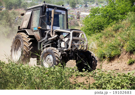 Farm tractor goes on road 19102683