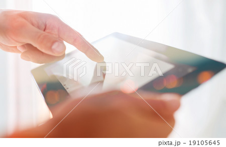 Man hand touching screen on modern tablet pc Man hand touching screen on modern tablet pc 19105645