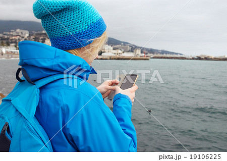 Young woman checking map on smartphone. Young woman checking map on smartphone. 19106225