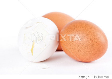 One broken and two whole eggs on white background 19106796
