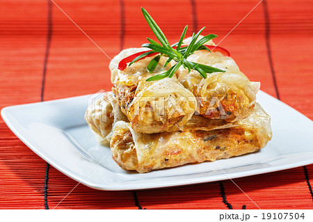 fried spring rolls on red bamboo mat fried spring rolls on red bamboo mat 19107504