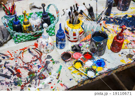 Paints and brushes on table Paints and brushes on table 19110671