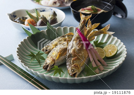 子持ち鮎の塩焼きと割烹料理の写真素材