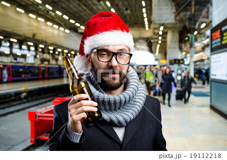 Young man with beer bottle Young man with beer bottle 19112218