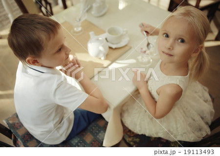 children 5-8 years old tea in a cafe 19113493