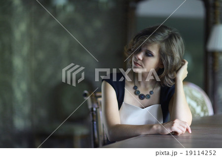 portrait of a beautiful sad girl in a blue dress portrait of a beautiful sad girl in a blue dress 19114252