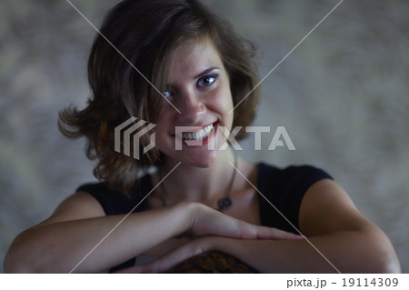 Portrait of a cheerful girl in a sexy blue 19114309