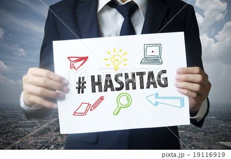 businessman show hashtag text on paper businessman show hashtag text on paper 19116919