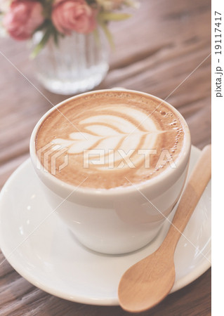 Cup of coffee latte art on wood table 19117417