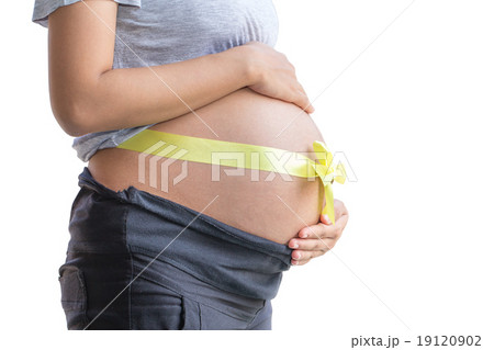 Abdomen a young pregnant woman tied with ribbon Abdomen a young pregnant woman tied with ribbon 19120902
