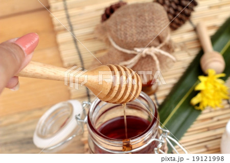 Honey variety with honeycomb and honey in a jar with beeswax. 19121998