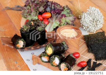 Vegetable salad wrapped with seaweed into spring rolls. 19122751