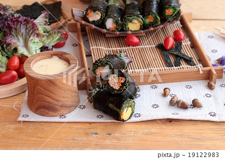 Vegetable salad wrapped with seaweed into spring rolls. Vegetable salad wrapped with seaweed into spring rolls. 19122983