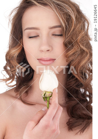 Close-up of beautiful girl with white rose flower Close-up of beautiful girl with white rose flower 19126645