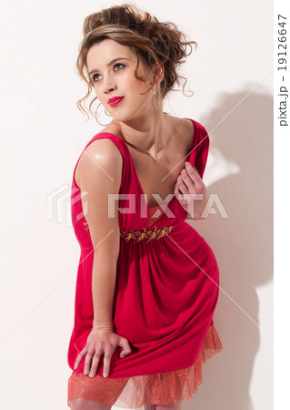 Close-up of beautiful girl with red vogue maekeup Close-up of beautiful girl with red vogue maekeup 19126647
