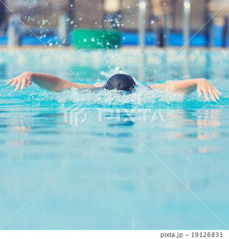 Young girl swimming butterfly stroke style Young girl swimming butterfly stroke style 19126831